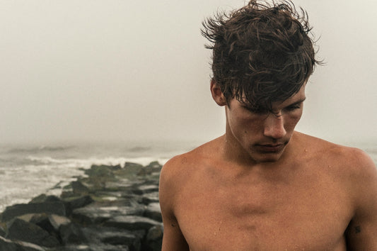 man behind sea during daytime