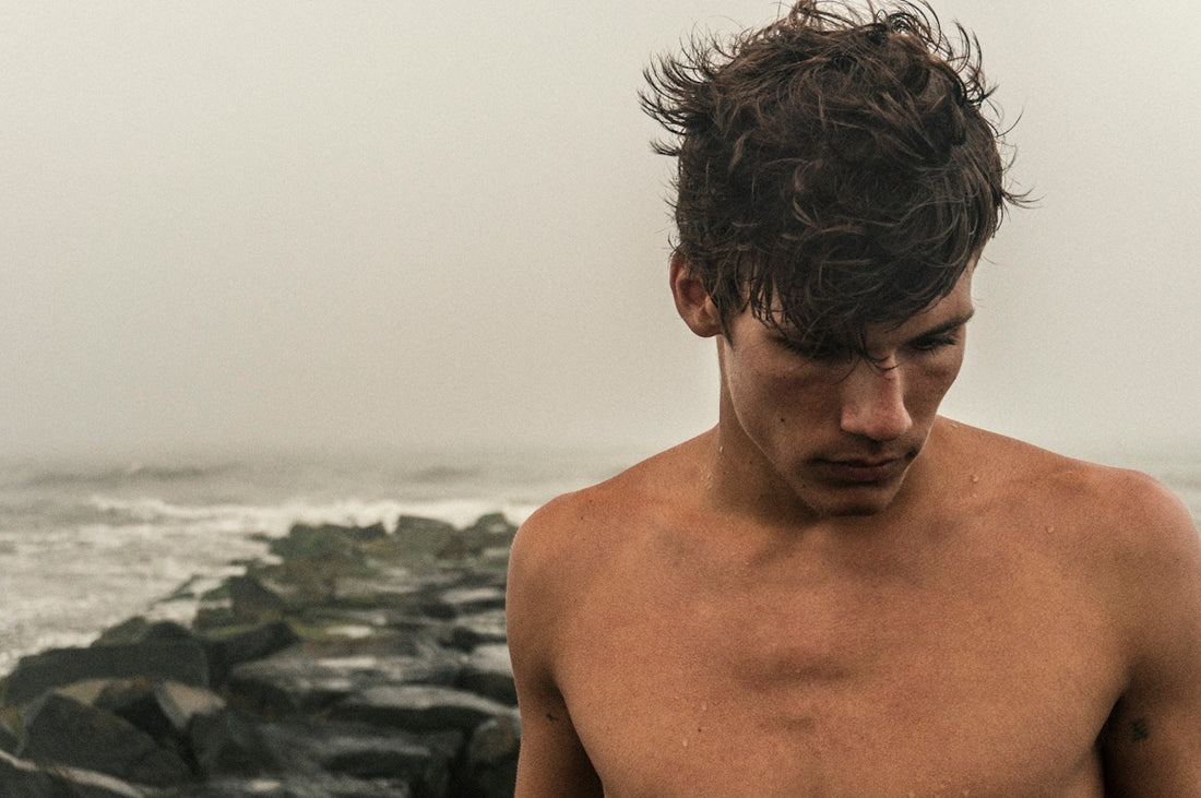 man behind sea during daytime
