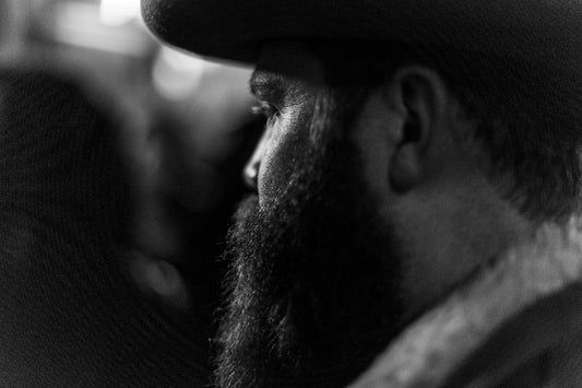 grayscale photo of bearded man