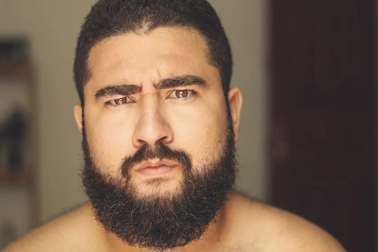 topless man with black beard Image