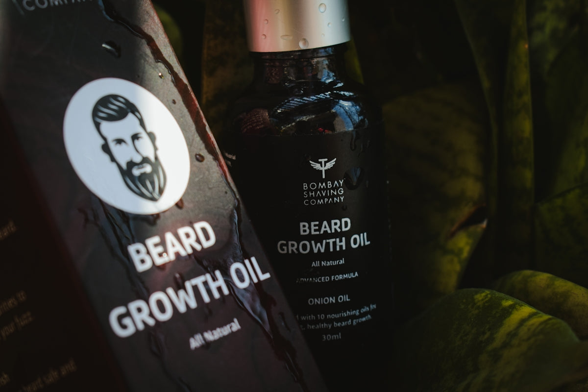 a bottle of beard growth oil next to some bananas Image
